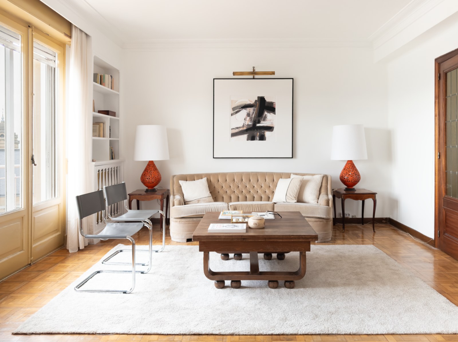 Staged living room with a light sofa and simple decor